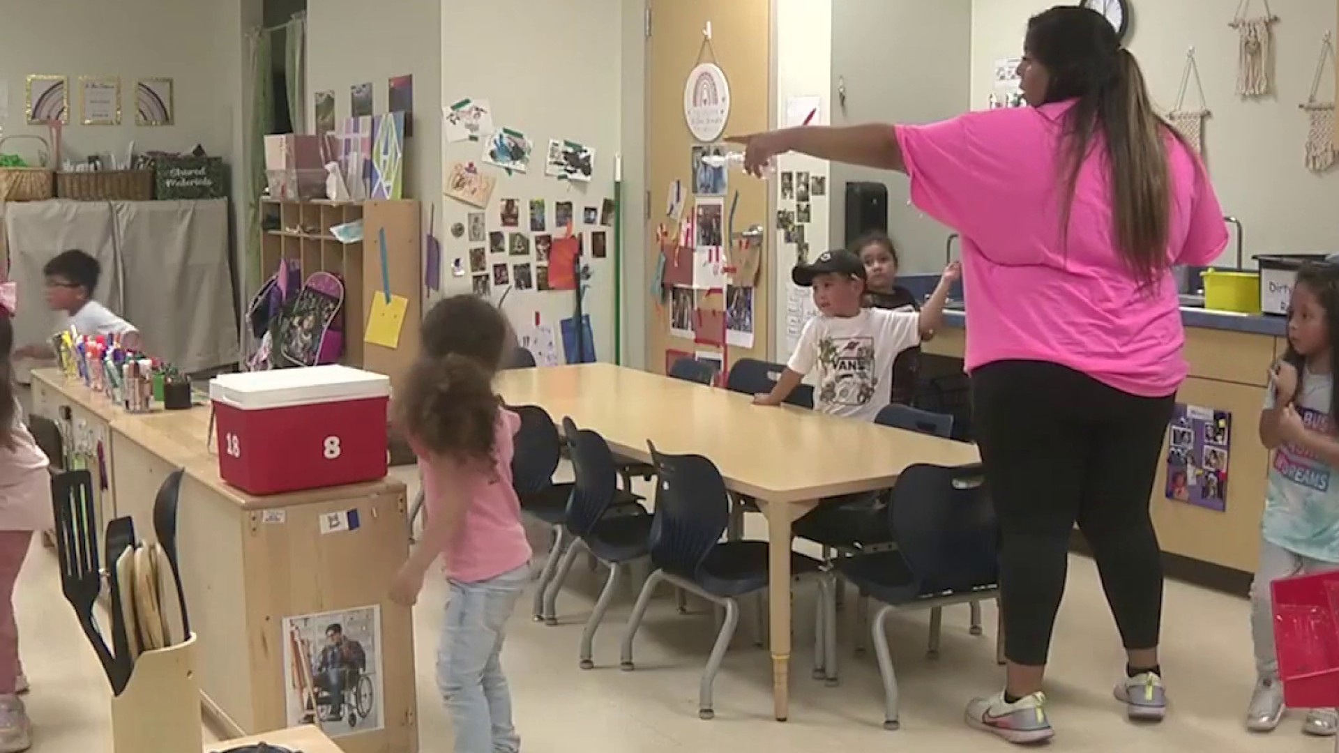 An educator and children in a classroom